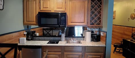 Fridge, microwave, stovetop, coffee/tea maker