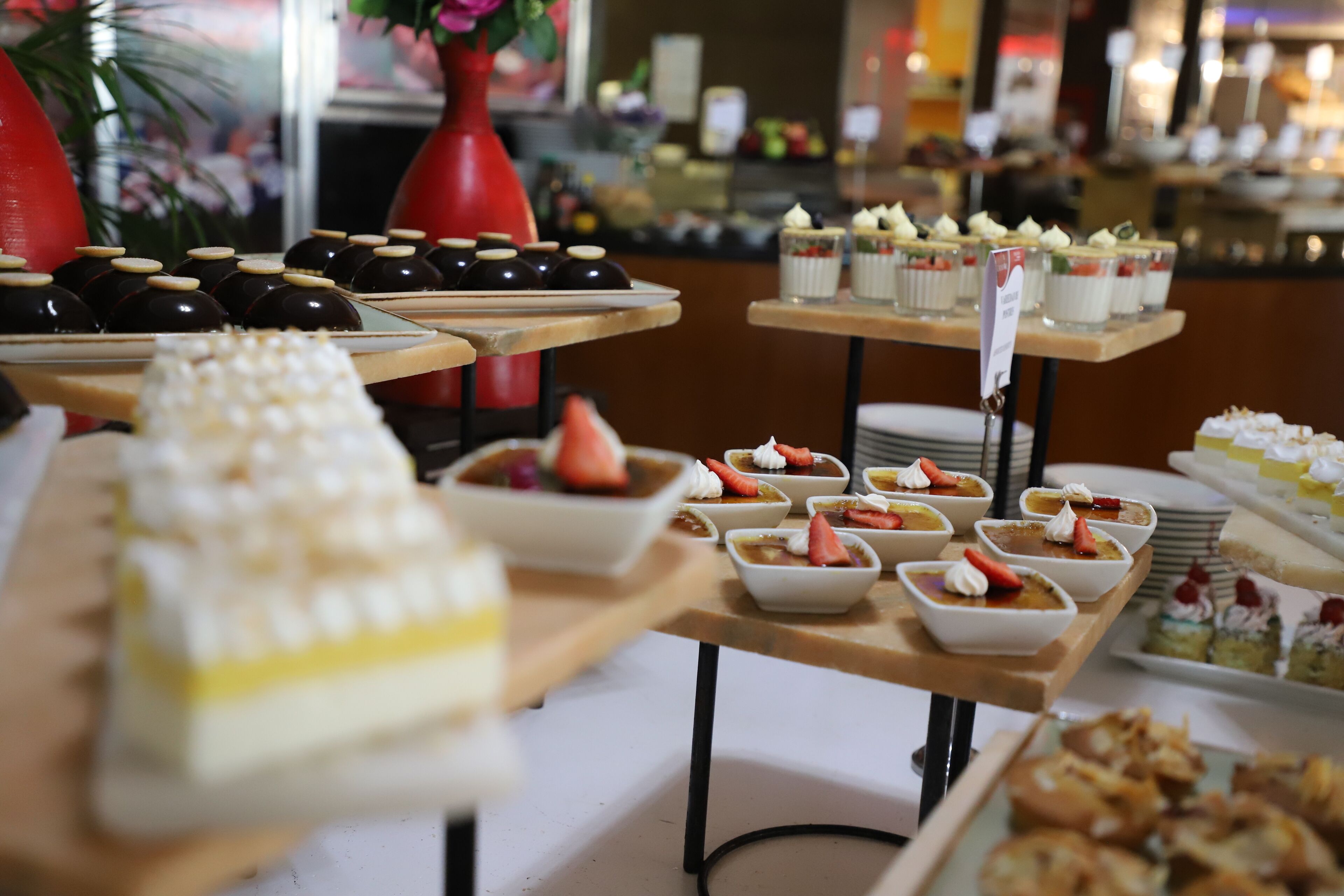 A buffet with various desserts and pastries.