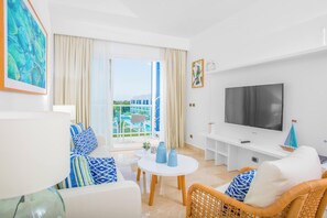 Basic Condo, Balcony, Golf View | Living area | Flat-screen TV