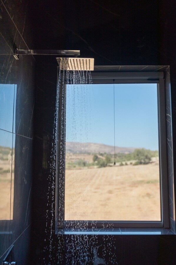 A window with a view of a desert landscape. - Amazing Property of 2 Villas on a Land sea View (Avola)
