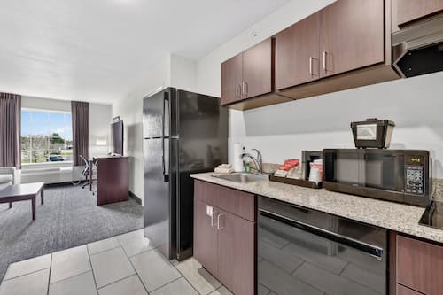 Suite, Mobility Accessible, Non Smoking (Single King Extended Stay) | Desk, laptop workspace, iron/ironing board, free WiFi