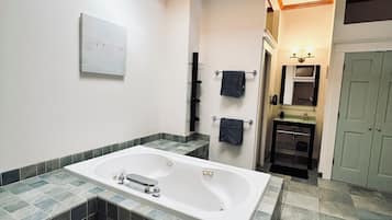Shower, jetted bath, towels, soap