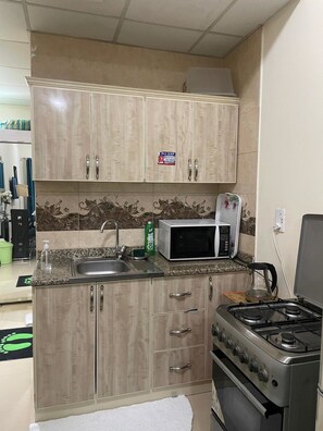 Apartment, 1 Bedroom, City View | Private kitchen - Friends Apartments by 1hataman (Dubai)