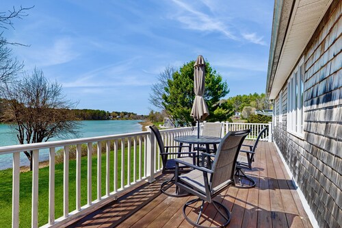 Tranquil waterfront home with stunning views, a spacious deck, and a BBQ grill