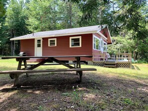 Outdoor dining -   This beautiful cottage is set back 25 feet from Bog Lake in Northfield, Maine! (Northfield)