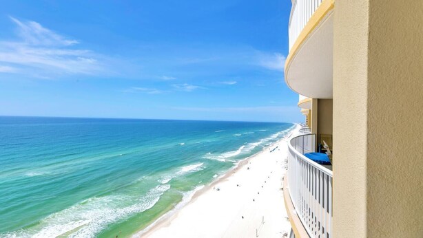 A balcony with a view of a beach and ocean. - Emerald Isle 1905 (Panama City Beach)