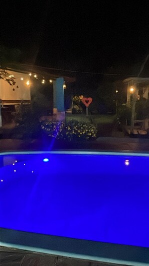 Outdoor pool, open 9:00 AM to 9:00 PM, pool umbrellas, pool loungers