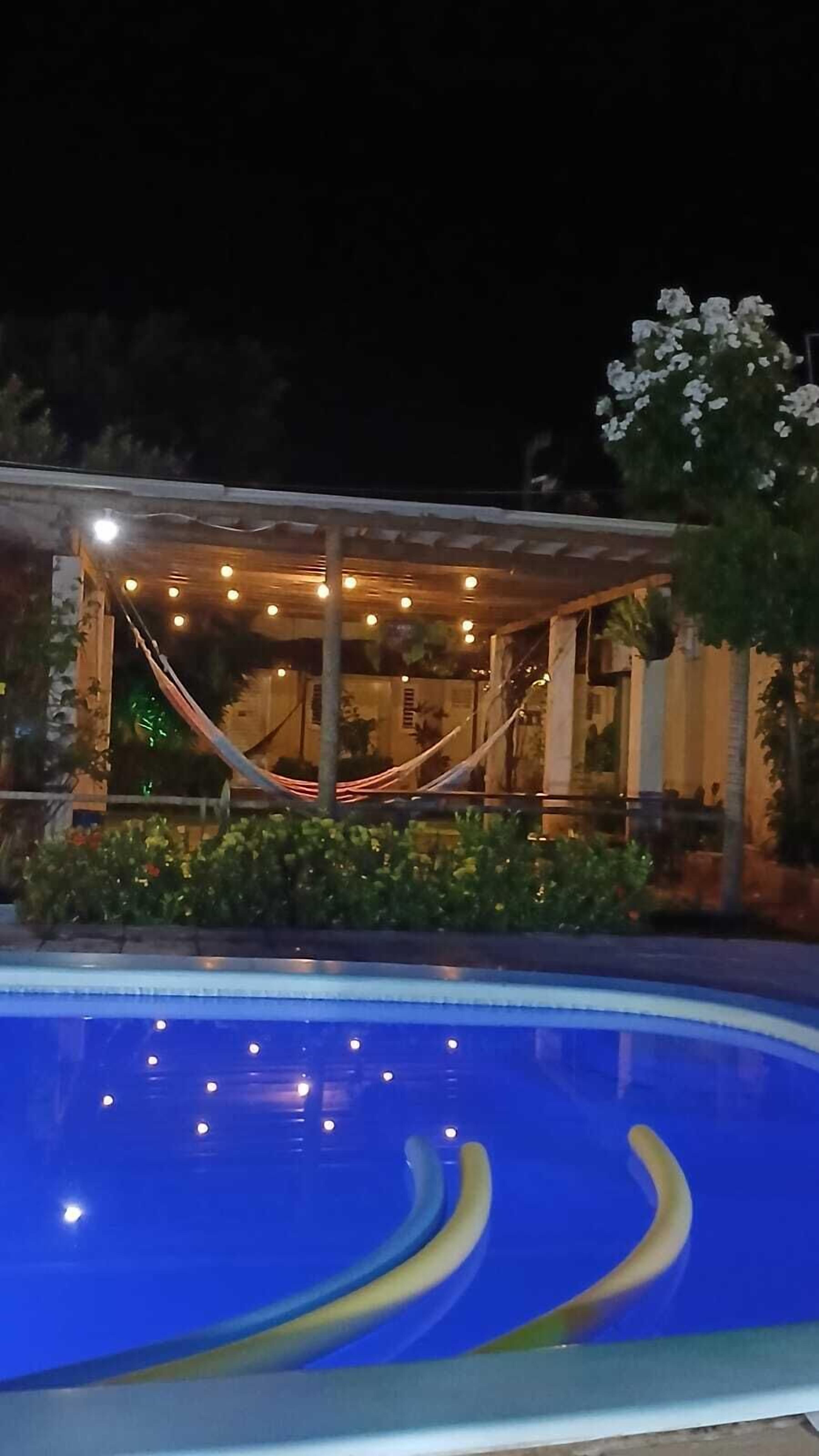 Outdoor pool, open 9:00 AM to 9:00 PM, pool umbrellas, sun loungers