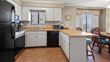 Condo, Multiple Beds, Pool Access, Ocean View (Sea Cloisters 105D) | Private kitchen | Coffee/tea maker