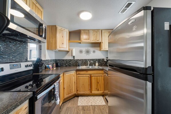 Fridge, microwave, stovetop, coffee/tea maker