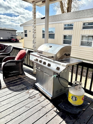 Enjoy al fresco dining on the deck with a stainless steel barbecue grill and comfortable seating.