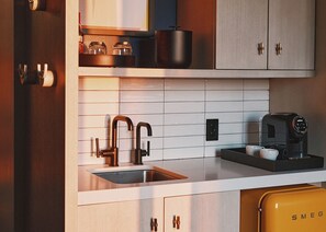 Suite (Boulder) | Living area | 65-inch Smart TV with cable channels, foosball, table tennis