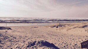 A beach with sand dunes and a wooden structure in the foreground. - Charming 1-bed/2 bath Cottage WiFi,AC, Beach, Pool, Fireplace
Pool Table, Ping (South Haven)