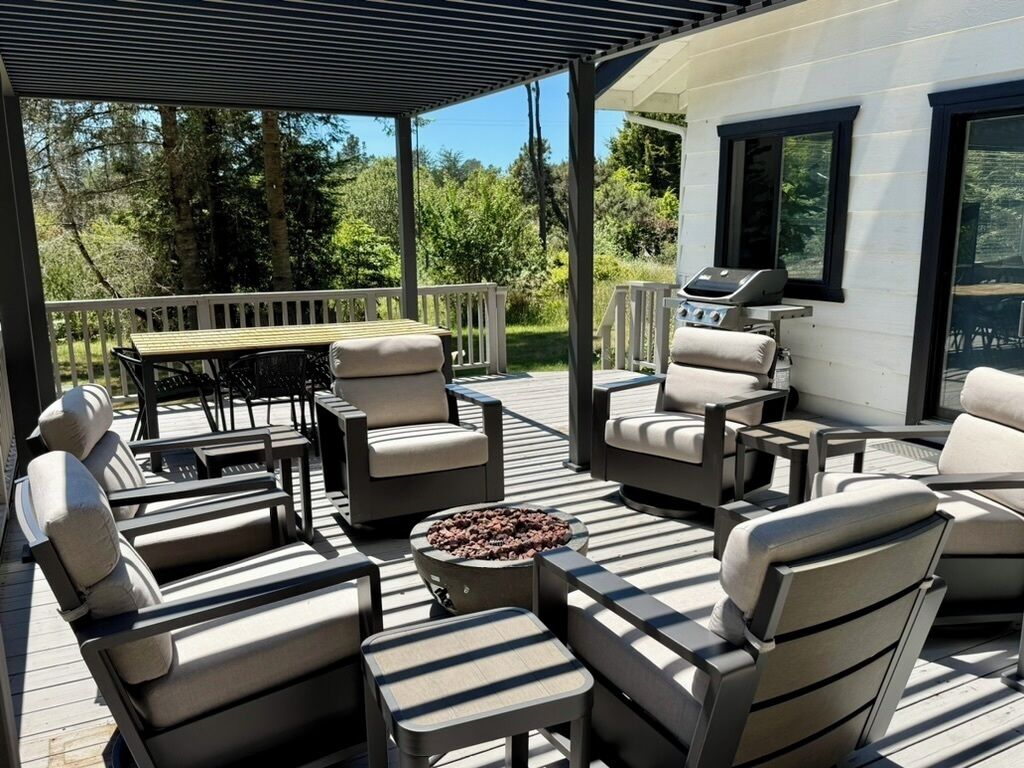 The main house deck has a gas fire pit and 6 swivel/rocking chairs