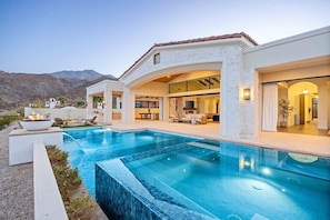 A modern house with a swimming pool, outdoor seating, and a view of the mountains. - Poolside Oasis, Golf Paradise, Hot Tub, Spa, Views (La Quinta)