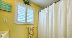 Eco-friendly toiletries, hair dryer, towels, toilet paper