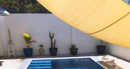 Family home with private pool one block from the beach