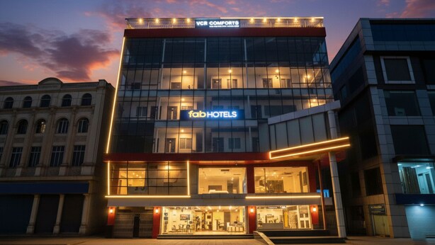 A modern hotel with a glass facade, 'VCR COMFORTO' signage, and 'fabHOTELS' branding. - Fabhotel Vgr Comforts (Hyderabad)
