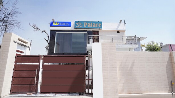 A hotel entrance with a sign for 'FabHotels' and 'Palace'. - Fabhotel Om Palace (Faizabad)