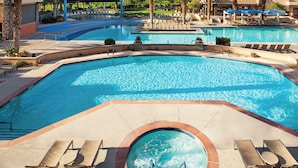A large outdoor swimming pool with multiple lanes, surrounded by lounge chairs and palm trees. - Coachella Fun and Luxury in the Desert - Marriott Shadow Ridge II - The Enclaves (Palm Desert)