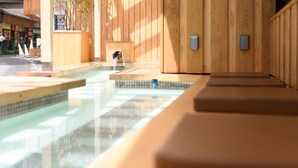 A wooden spa area with a small pool and seating. - Yukawa Terrace (Kusatsu)