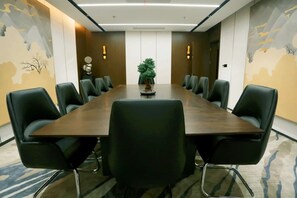 Meet in style with a spacious conference table and comfortable seating for all.