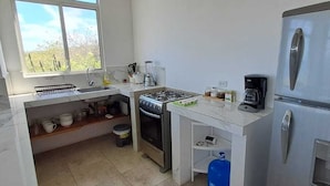 Family Apartment, Balcony, Beach View | Private kitchen - Cabañas Don Jorge (Puerto Baquerizo Moreno)