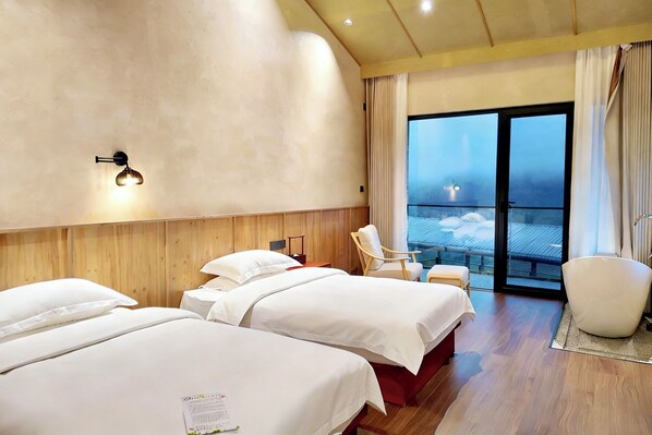 A hotel room with two beds, a wooden headboard, a large window with a view, and a chair by the window. - Yichun Old Yu Xinzhi Homestay (Yichun)