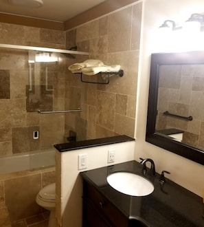 Shower, jetted bath, hair dryer, towels