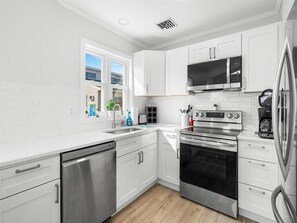 Microwave, stovetop, dishwasher, coffee/tea maker