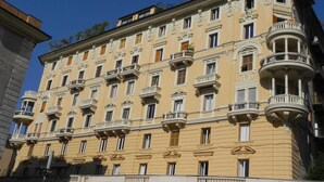 A multi-story building with ornate balconies and a classic architectural style. - Rooms Palazzo Groppallo  (Genoa)