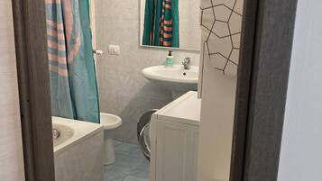 Hair dryer, bidet, towels, soap