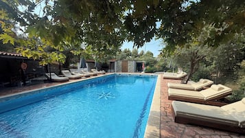 Outdoor pool, open 8:00 AM to 9:00 PM, pool loungers