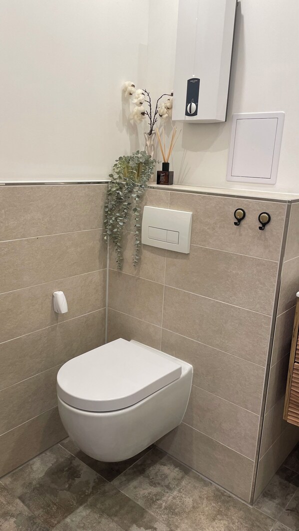Hair dryer, towels, soap, toilet paper