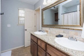 Shower, hair dryer, towels, shampoo