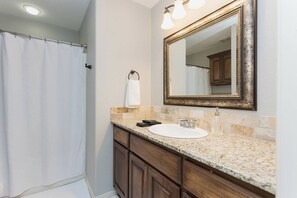 Shower, hair dryer, towels, shampoo