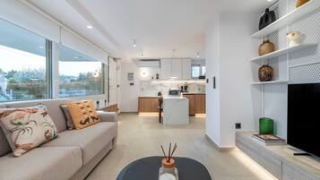 Standard Apartment, Garden View | Living area | 42-inch Smart TV with satellite channels, Netflix, streaming services