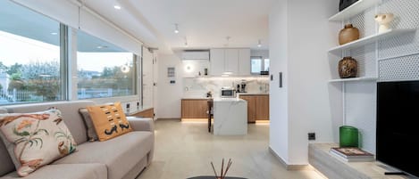 Standard Apartment, Garden View | Living area | 42-inch Smart TV with satellite channels, Netflix, streaming services