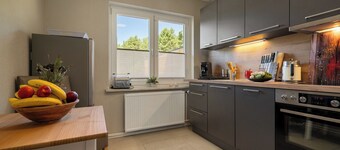 Relaxing vacation apartment on the Müritz with terrace, garden - for families with dogs