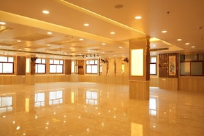 A spacious, well-lit hotel lobby with a polished marble floor, large windows, and a modern ceiling design. - Hotel Golden Palace (Lucknow)