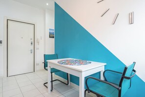 Enjoy a stylish space with a round table and two chairs, perfect for relaxing and socializing.