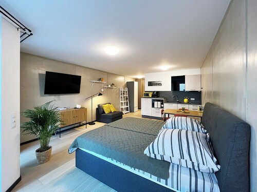 Bonquartier | Design apartment with balcony, parking space + charging station