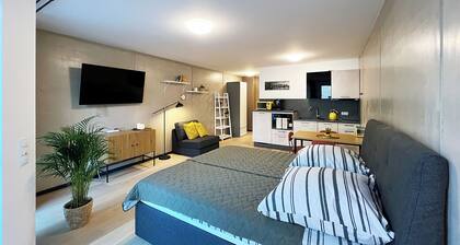 Bonquartier | Design apartment with balcony, parking space + charging station