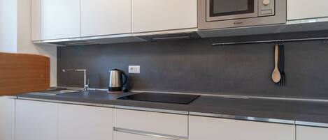 Fridge, microwave, stovetop, cookware/dishes/utensils
