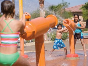 A water play area with orange structures and water jets. - Marriott's Shadow Ridge  Studio Suite (Palm Desert)