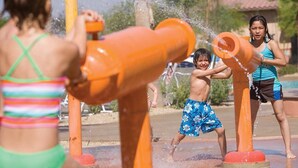 A water play area with orange structures and water jets. - Marriott's Shadow Ridge  One-Bedroom Villa (Palm Desert)