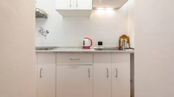 Departamento, 2 habitaciones | Cocina privada | Parrilla de estufa y comedor