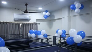 A room with bunk beds, a ceiling fan, and air conditioning unit. - Fostel The Fort Hostel (Mumbai)