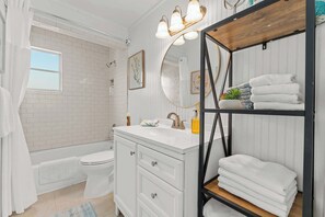 Shower, hair dryer, towels, shampoo
