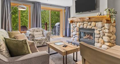 Creekside Condo Steps from Main Street | Mountain Views + Fireplace